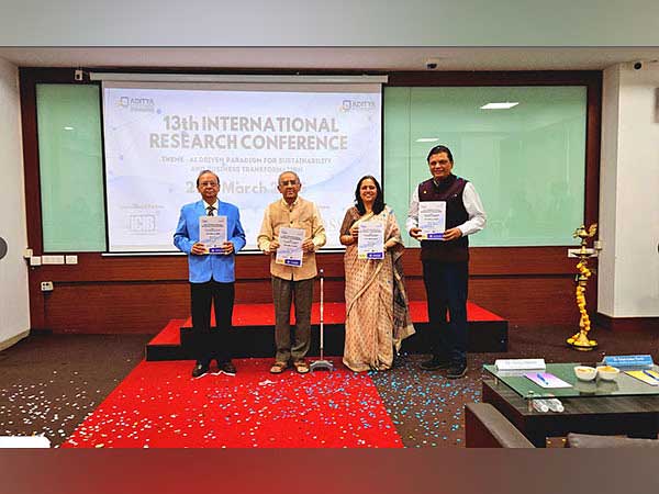 Dignitaries holding awards at the 13th International Research Conference